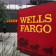 A sign is posted in front of a Wells Fargo bank Oct. 11, 2013, in Oakland, Calif.
Justin Sullivan/Getty Images